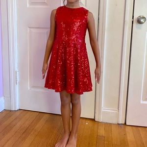 Girl’s glittering beautiful holiday red dress